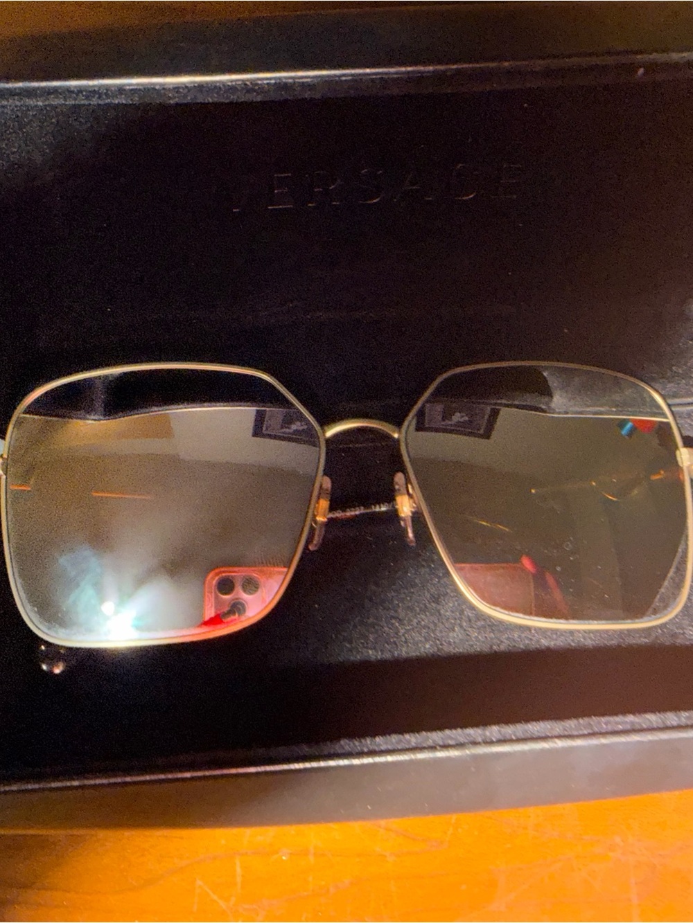 Versace Women's Gold Metal Frame Sunglasses with pink mirrored Lenses